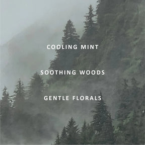 Misty evergreen forest scene with white text reading 'COOLING MINT', 'SOOTHING WOODS', and 'GENTLE FLORALS' centered on the image.