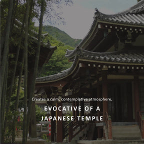 A scenic photograph of a traditional Japanese temple with dark tiled roofs, wooden structures, and tall bamboo trees, with overlaid text reading 'Creates a calm, contemplative atmosphere, EVOCATIVE OF A JAPANESE TEMPLE'.